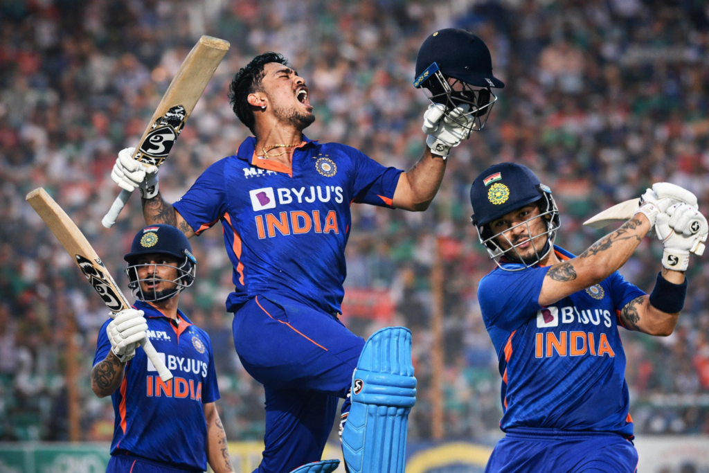 Ishan Kishan celebrating with bat and helmet after scoring for India in international cricket match